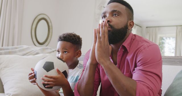 Father and Son Watching Soccer Game Enthusiastically - Download Free Stock Images Pikwizard.com