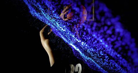 Athlete shooting basketball with futuristic digital stream