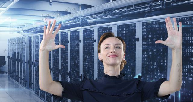 Businesswoman Celebrating Success in Data Center - Download Free Stock Images Pikwizard.com