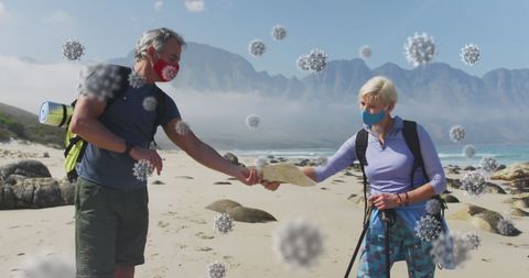 Senior Couple Hiking on Beach with Covid-19 Cells Overlay