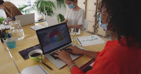 Diverse Team Collaborating Safely in Office