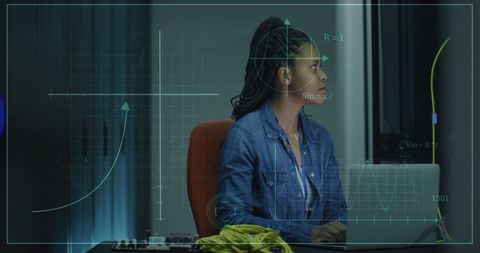 Businesswoman analyzing scientific data on laptop