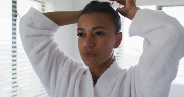 Woman in White Bathrobe Styling Hair at Home - Download Free Stock Images Pikwizard.com