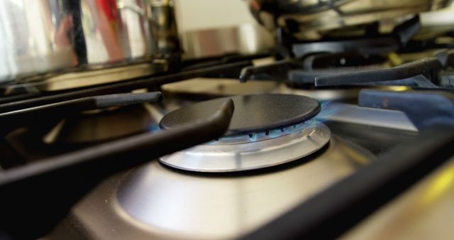 Close-Up of Gas Stove Burner with Blue Flame - Download Free Stock Images Pikwizard.com