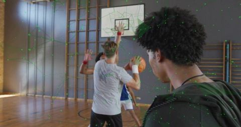 Youth basketball team engaged in intense practice in gym