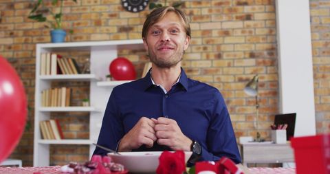 Man Celebrates Valentine's Day Virtually with Heart Gesture - Download Free Stock Images Pikwizard.com