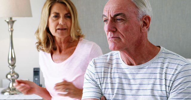 Senior Couple in Midst of Discussion at Home - Download Free Stock Images Pikwizard.com