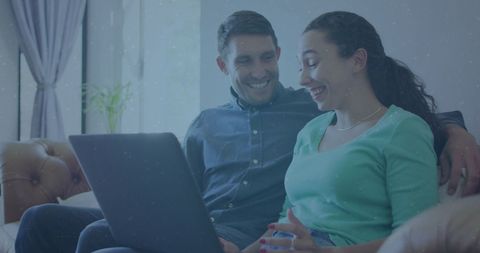 Happy Coworkers Sharing Laptop on Couch Collaborative Teamwork