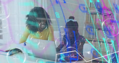 Mother and Daughter Using Laptop with Digital Network Overlay