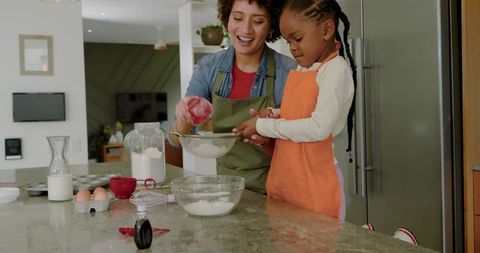 Mother and Daughter Baking Bonding in Kitchen Home Lifestyle