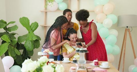 Women Celebrating Friendship During Joyful Tea Party