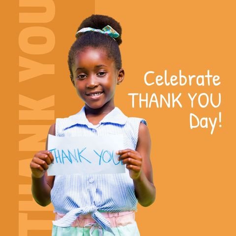 Smiling african american girl celebrates thank you day with handmade sign