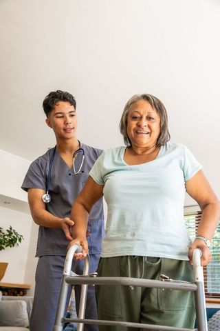 Senior Woman Receives Home Assistance from Caring Nurse