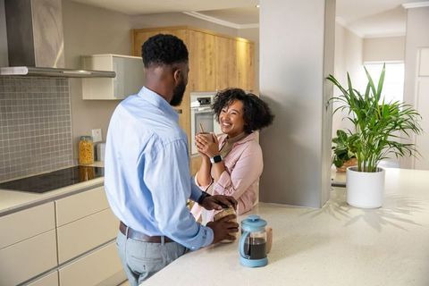 Happy Couple Enjoying Morning in Cozy Modern Kitchen