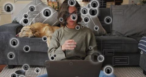 Remote worker typing on laptop on living room floor with dog and chat overlay network