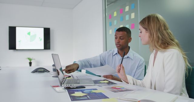 Business Meeting with Diverse Team Analyzing Data on Laptop - Download Free Stock Images Pikwizard.com