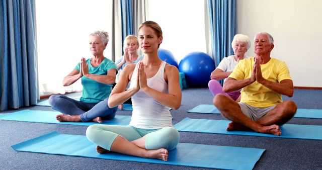 Senior Citizens Practicing Yoga in Studio - Download Free Stock Images Pikwizard.com