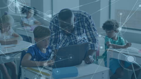 Teacher with Diverse Students Interacting Using Laptop in Classroom