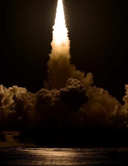 H-IIA rocket launching from Tanegashima Space Center, Japan, carrying GPM Core Observatory. Flames and smoke are visible against the night sky. This image can be used for topics related to space exploration, NASA and JAXA collaborations, satellite technology, and aerospace advancements.
