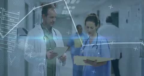 Medical Professionals Analyzing Digital Healthcare Data in Hospital Corridor