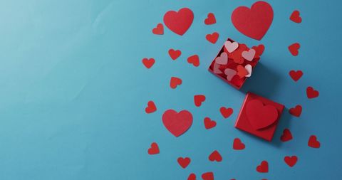 Creative Valentine Concept with Red Hearts and Gift Box on Blue Backdrop - Download Free Stock Images Pikwizard.com