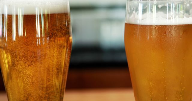 Close-Up of Two Glasses of Beer with Foam - Download Free Stock Images Pikwizard.com