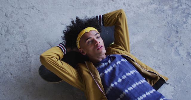 Teenage Boy Relaxing with Skateboard, Wearing Yellow Headband - Download Free Stock Images Pikwizard.com