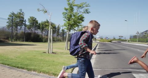 Children Safely Crossing Street in Slow Motion with Schoolbags