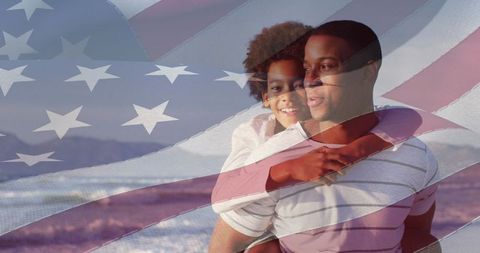 African american father and son with american flag overlay