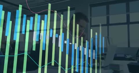 Businessman Analyzing Data on Laptop in Office with Financial Graph Overlay