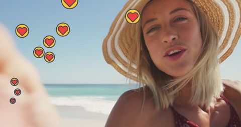 Cheerful Woman on Beach with Social Media Heart Icons