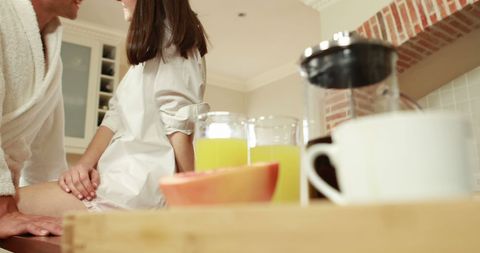 Happy Couple Sharing Romantic Breakfast in Cozy Kitchen