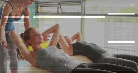 Women Performing Abdominal Crunches in Modern Fitness Studio