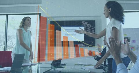 Businesswomen Shaking Hands in Modern Office with Data Interface