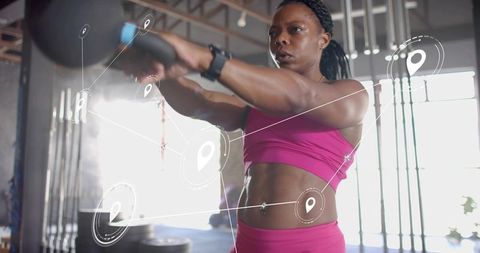 Black woman swinging kettlebell during strength training with fitness HUD overlay