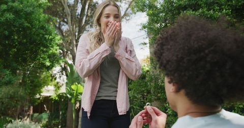Surprised Woman Receiving Marriage Proposal in Lush Garden - Download Free Stock Images Pikwizard.com