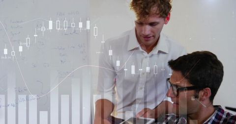 Young Business Professionals Analyzing Data with Digital Charts