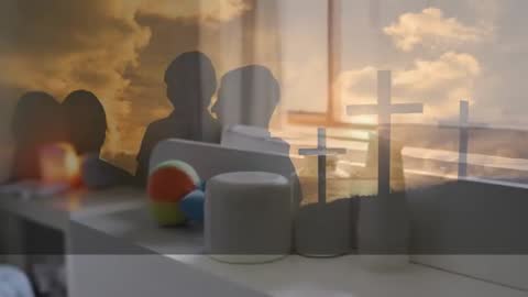 Silhouetted Figures with Crosses at Sunset Symbolizing Unity and Faith