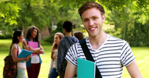 Smiling Caucasian Student Outdoors on University Campus - Download Free Stock Images Pikwizard.com