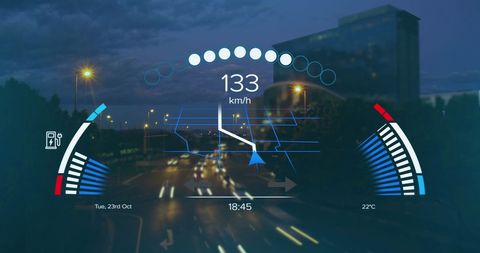 Futuristic digital interface with speedometer and gps displaying over night city traffic