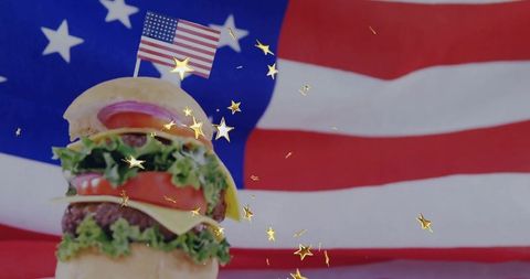 Cheeseburger with american flag toothpick in patriotic setting