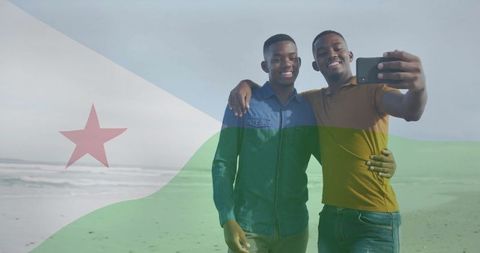 Friends Enjoying Beach Day with Djibouti Flag Overlay Selfie