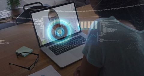 Conducting remote video consultation with holographic UI and data overlay on laptop