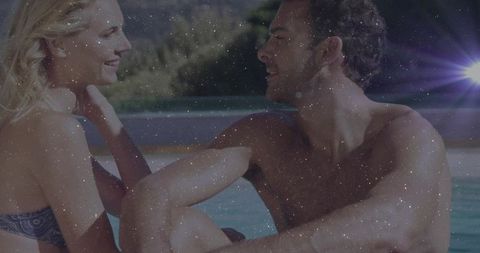 Smiling Couple Enjoying Relaxing Moments at Poolside