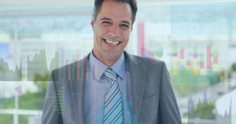 Smiling corporate executive wearing suit and tie with transparent financial data visuals