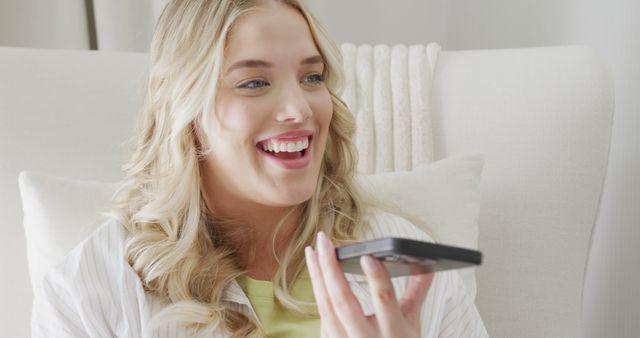 Smiling Woman Using Smartphone Voice Assistant at Home - Download Free Stock Images Pikwizard.com