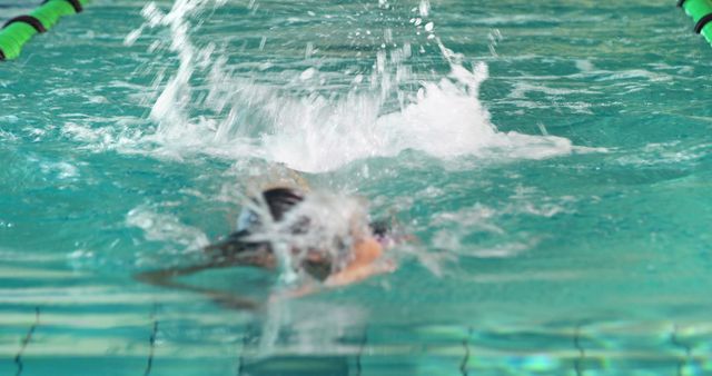 Person Swimming Fast in Indoor Pool Creating Splash - Download Free Stock Images Pikwizard.com