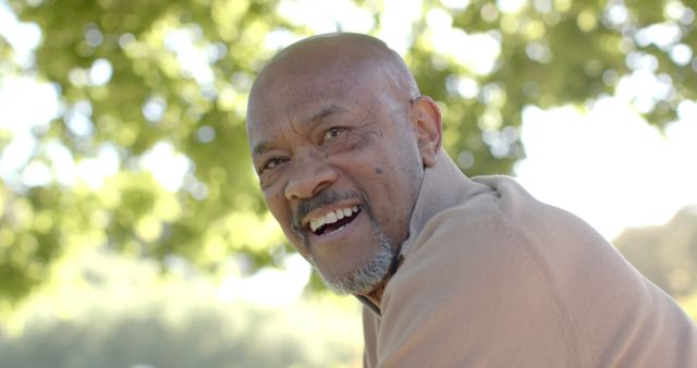 Happy Senior Man Enjoys Outdoor Leisure in Park - Download Free Stock Images Pikwizard.com