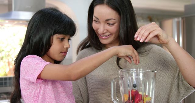 Mother and Daughter Making Healthy Smoothie Together - Download Free Stock Images Pikwizard.com