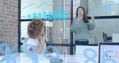 Business Women Discussing Data Analytics in Modern Office - Download Free Stock Images Pikwizard.com